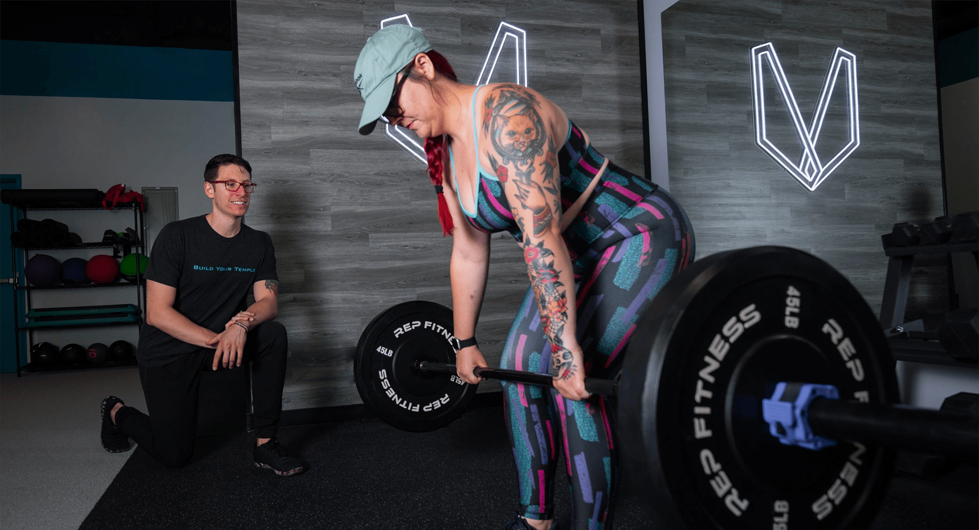 Woman training with her personal trainer at Pantheon Training Systems